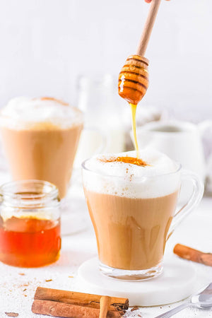 Honey Oat Latte with Coconut Whipped Cream Finished with Rum Spice Honey